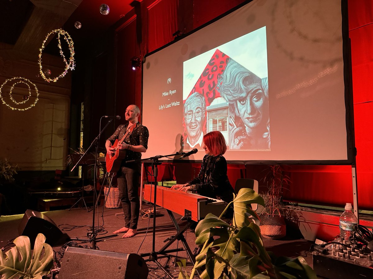 <a href="/LEAFonBoldSt/">LEAF on Bold St</a> <a href="/KingByrne1/">King & Byrne</a> <a href="/HelenMawMusic/">Helen Maw</a> <a href="/JamesChetter/">James Chetter</a> <a href="/jimpearsonmusic/">Jim Pearson</a> <a href="/LiverpoolCAMRA/">Liverpool CAMRA</a> <a href="/The_Bridewell/">The Bridewell</a> The penultimate finalist is last year’s Audience Favourite winner Mike Ryan with his song Lilly’s Last Waltz, inspired by Wirral’s Paul O’Grady and Lily Savage mural painted by local artist Brezaux. Mike is joined by <a href="/Nicola_Hardman/">Nicola Hardman</a> on keyboard.