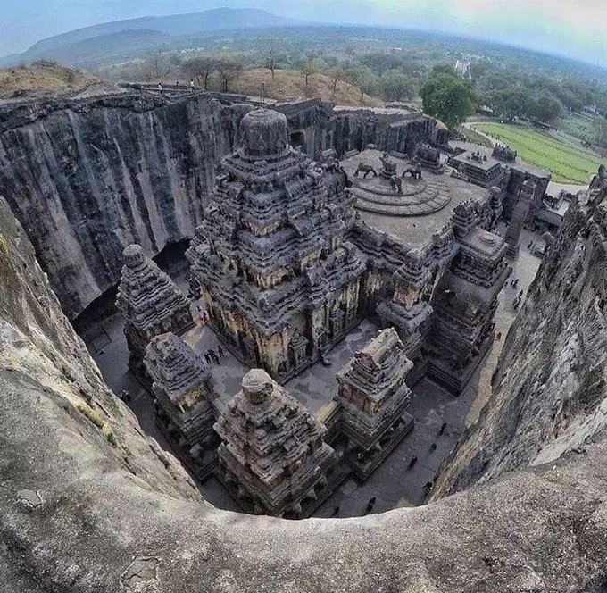 The Kailasa temple in the Ellora Caves, Maharashtra, India, was made in the VII century. It is a megalith carved out of one single rock and it is considered one of the most remarkable cave temples in India because of its size, architecture and sculptural treatment.
