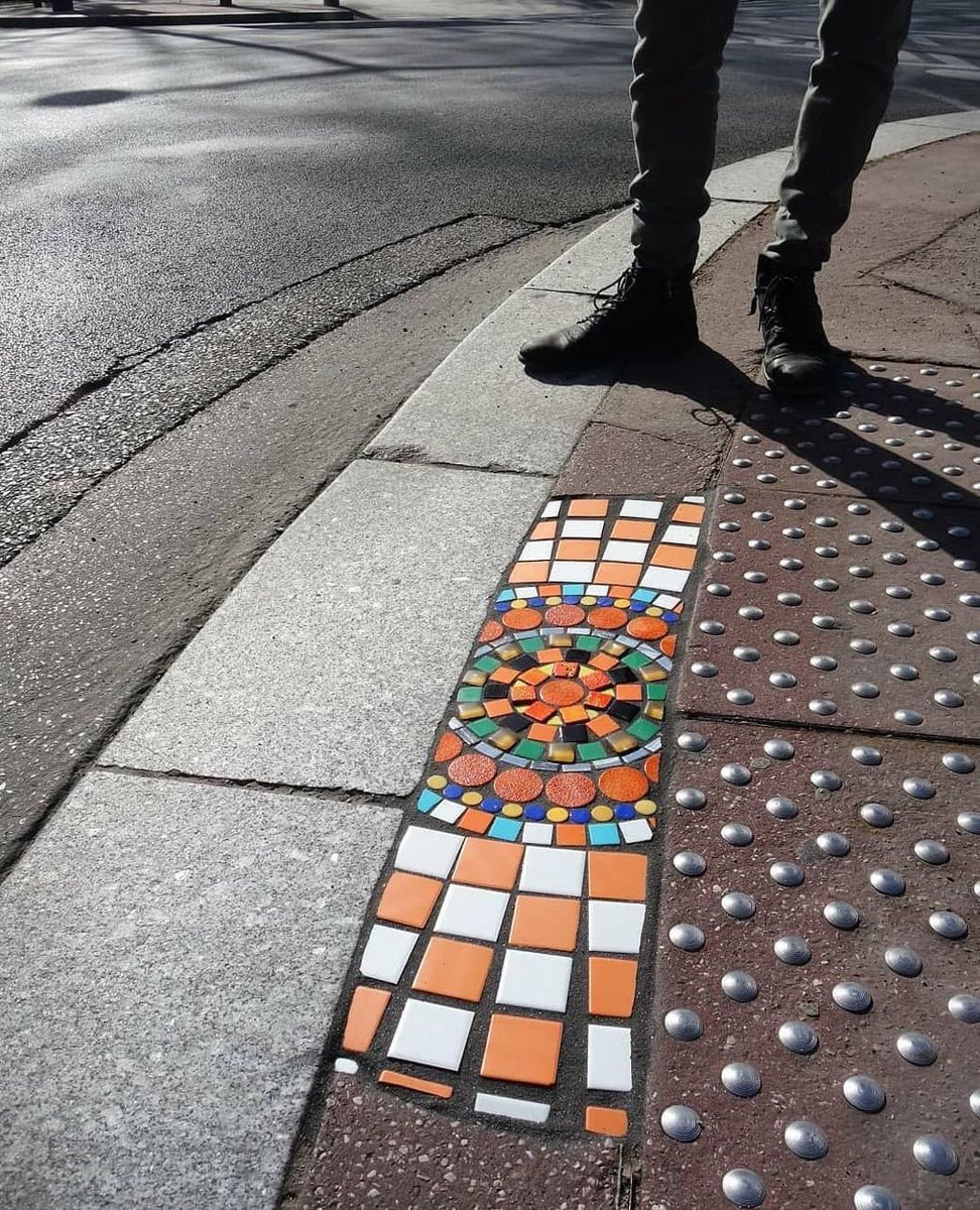 HWarlow's tweet image. There is a group of folk going around filling pavements and cracks with mosaics.   
I’m having problems getting tweets out…Sorry.   
The brainchild of this operation on the streets is from Lyon ‘Ememem 
‘Pavement Surgeon
