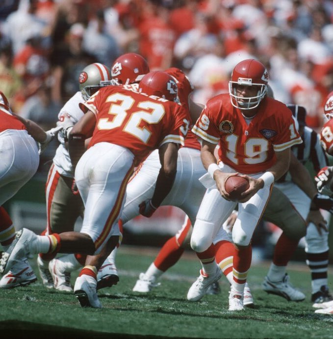 Joe Montana of the Kansas City Chiefs about to hand the ball off to running back Marcus Allen. #JoeMontana #MarcusAllen #KansasCityChiefs #KansasCity #Chiefs #football