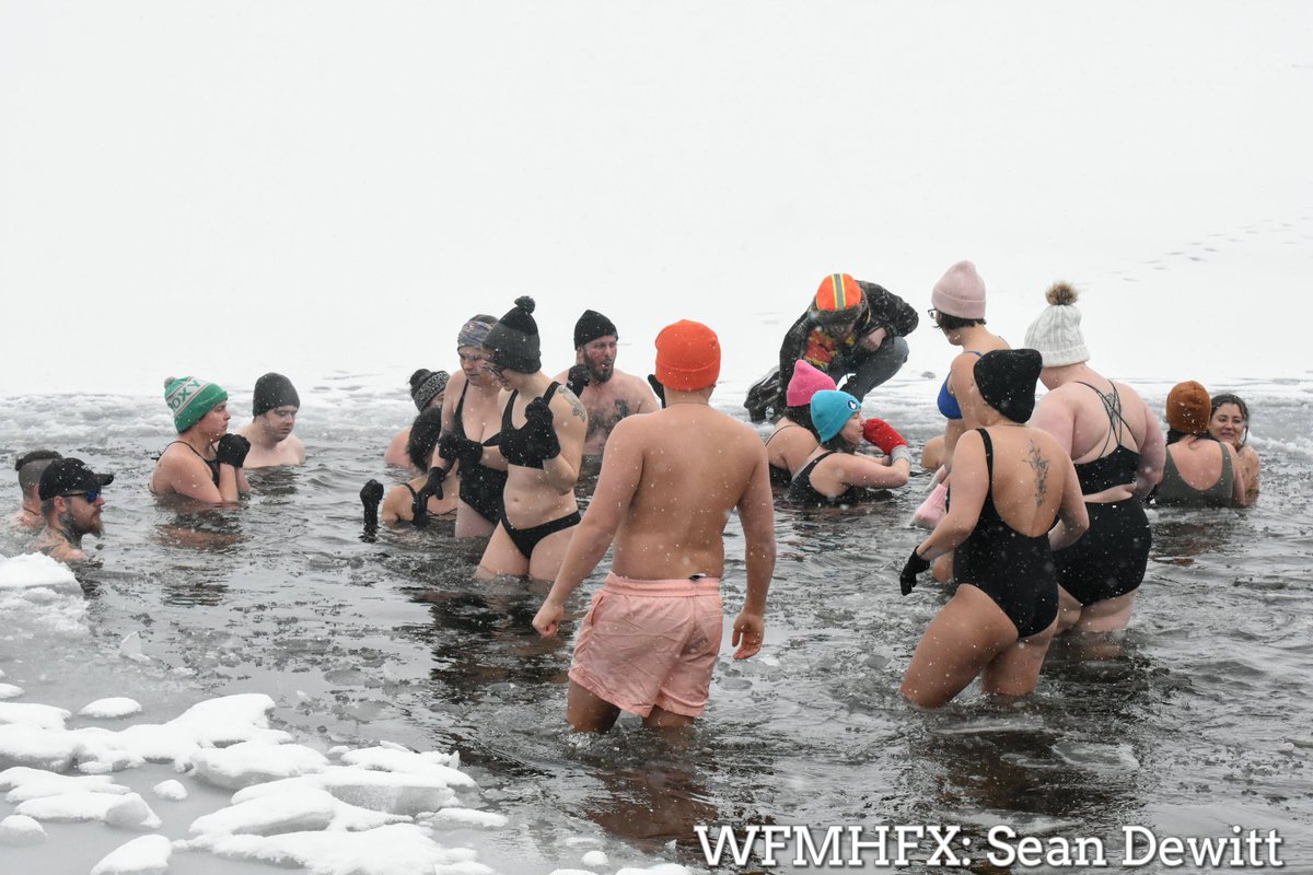 HfxMda's tweet photo. In photos - Flurries fell as more brave souls tackled the icy waters of Lake Banook

More photos on our Facebook page or online here

https://t.co/jaJwEn7opo https://t.co/QHL92H3EeD