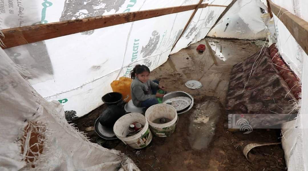 Tents of displaced people are flooded with rainwater in Der Al-Balah