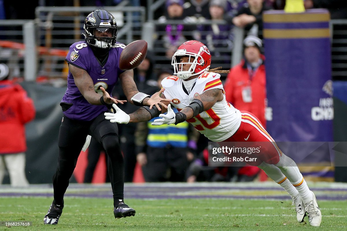 #LamarJackson of the Baltimore #Ravens beats Justin Reid of the Kansas City Chiefs to his own pass after it was tipped in the second quarter of the #AFCChampionshipGame 📸: @RobertLeeCarr #RavensFlock #NFLPlayoffs