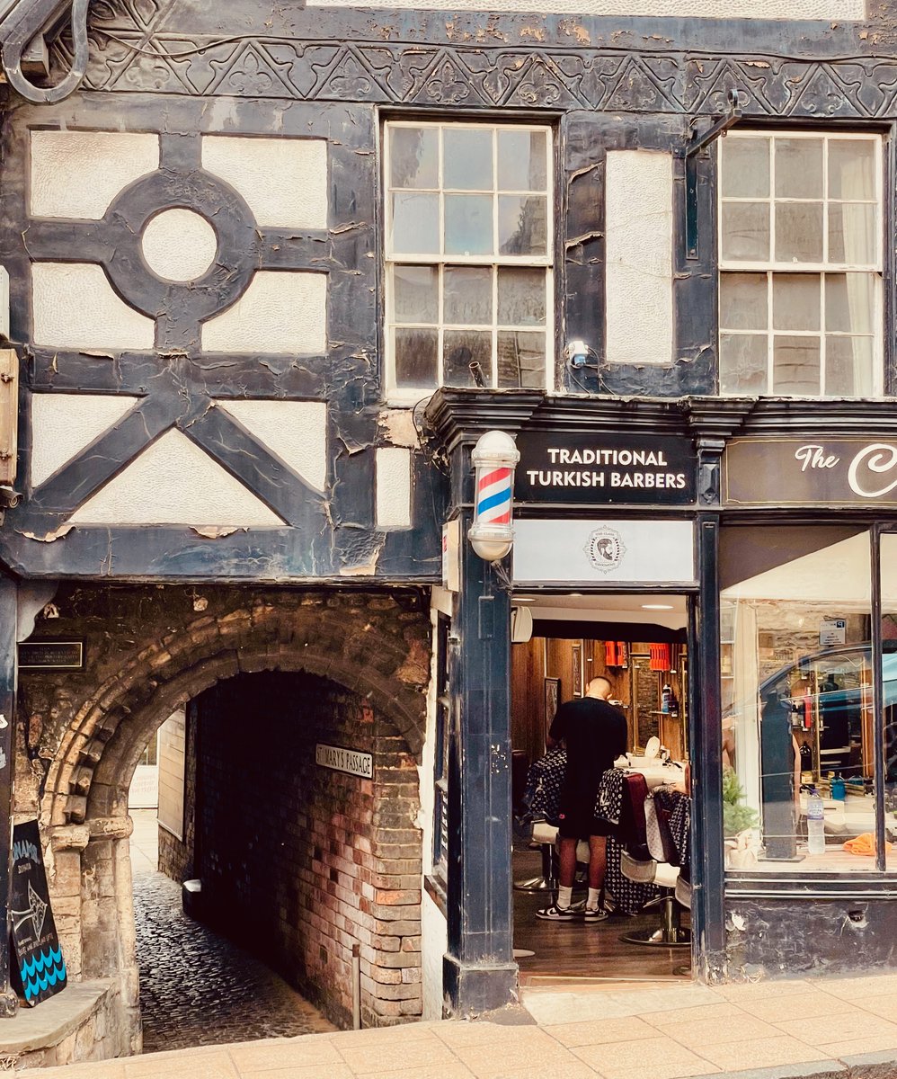 fotofacade's tweet image. Like a wormhole into different time. 🕰️
C12th Romanesque entrance to St. Mary's passage in Stamford, Lincs is framed by a C19th Dickensian facade. If buildings could speak...