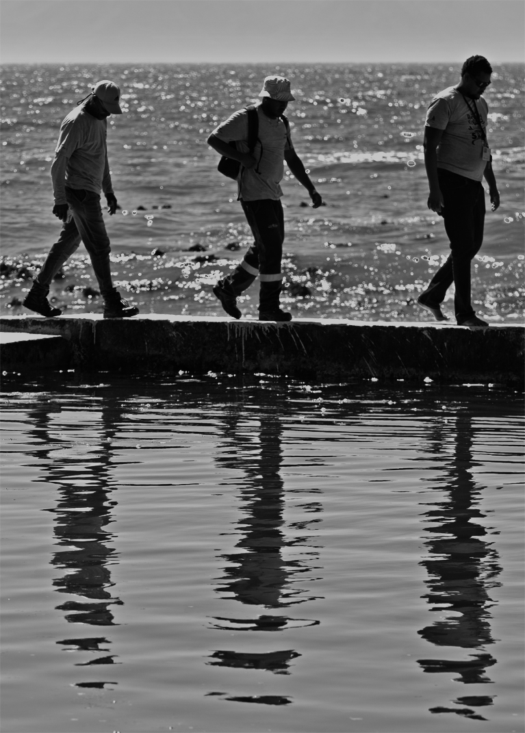 Trio reflecting #kalkbay #blackandwhite #streetphotograph