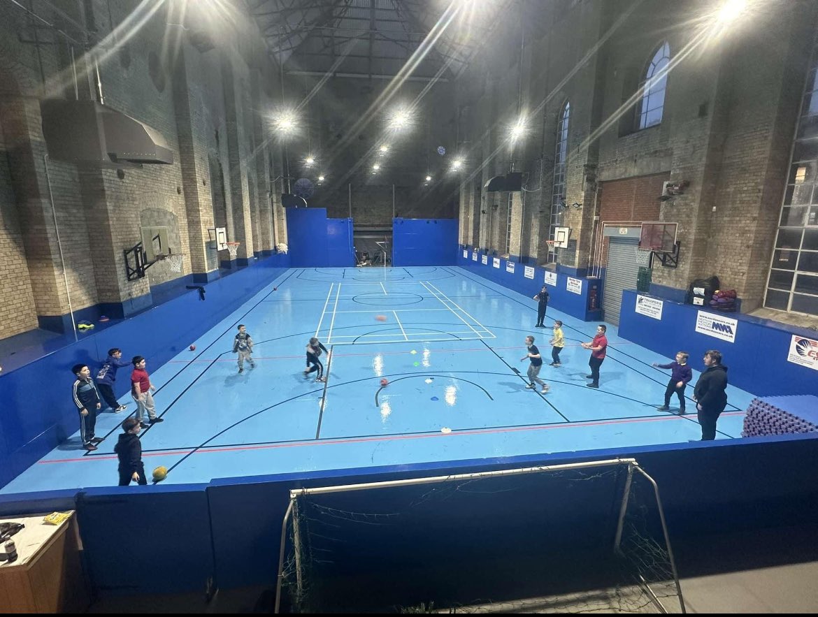 Some of the children enjoying their first session of dodgeball in the new hall today.