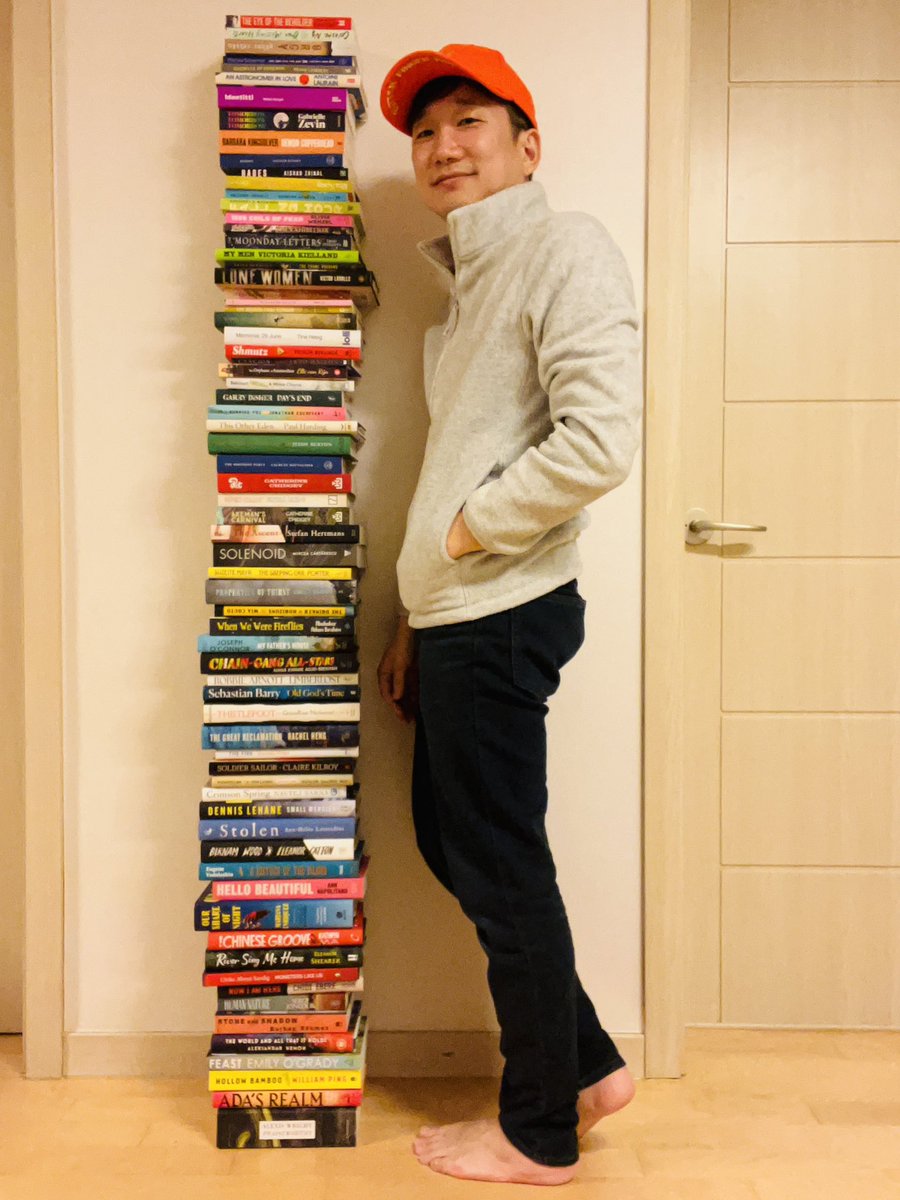 Obligatory book-prize-judge-compares-own-height-with-book-stack shot