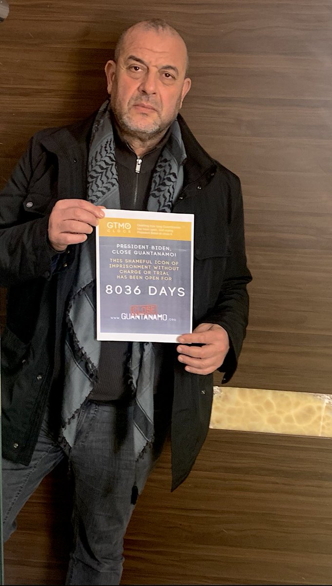 GuantanamoAndy's tweet image. Thanks to former #Guantanamo prisoner Ahmed Errachidi for sending in a photo with our poster marking 8,036 days of #Guantanamo's existence last week, bring the total number of photos received to 110! See all the photos here: closeguantanamo.org/Gitmo-Clock-20…