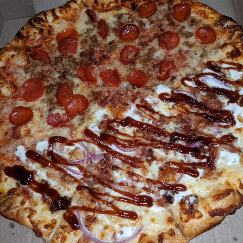mklopez's tweet photo. I'm sure there'll be consequences later, but the first #pizza of 2024 is happening tonight: Half pepperoni and meat, half bbq chicken from #localpie https://t.co/hOcu4TTtHR