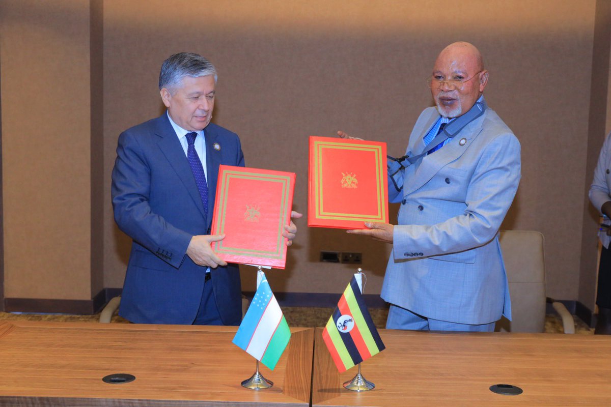 UgandaMFA's tweet photo. The Minister of Foreign Affairs, Hon. @GenJejeOdongo , and H.E. Bakhromjon Aloyev, Deputy Minister of Foreign Affairs for the Republic of Uzbekistan, have signed a M.O.U to establish diplomatic relations. This significant event took place during the #NAMSummitUg2024. https://t.co/iBcekEkXYk