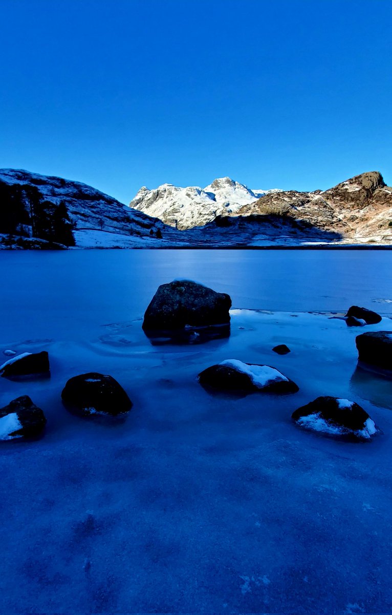 A frozen Blea Tarn with the Langdale Pikes enjoying some late afternoon sun. 17/01/24.