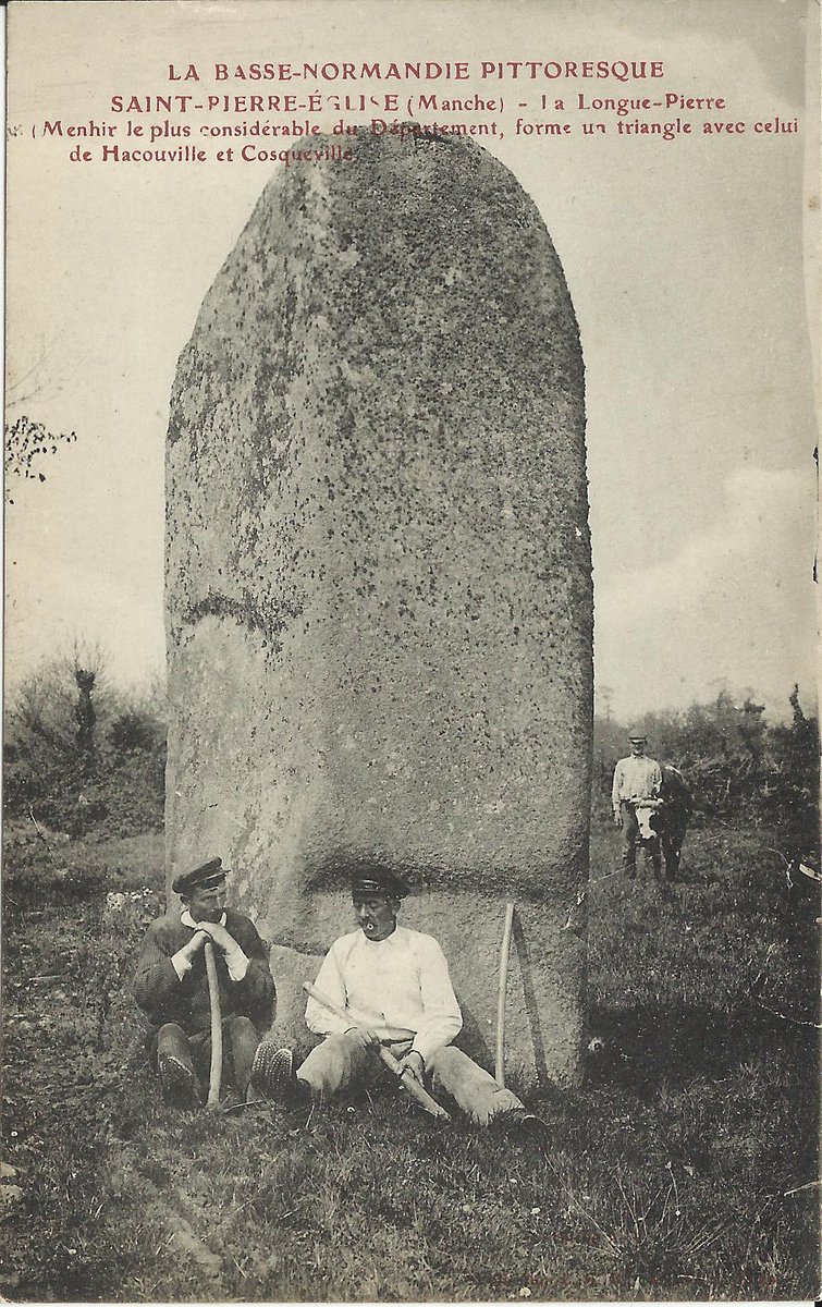 The chunky granite menhir of La Longue Pierre in St-Pierre-Église (Manche) is 4.2m high and roughly square in section with each face just over a metre wide coming to a rounded top. Card by L.G.B. c. 1905 and reflects a contemporary description that it was in a poorly kept meadow.