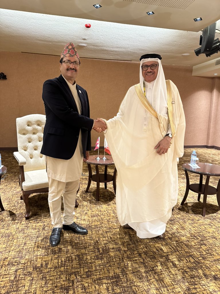MofaNepal's tweet photo. Foreign Minister Hon @NPSaudnc and Foreign Minister of Kingdom of Bahrain H.E. Dr. Abdullatif bin Rashid Alzayani meet on the sidelines of NAM Summit in Kampala today. The two Ministers appreciate growing engagements between the two countries, including people-to-people exchange. https://t.co/5UQesWfpCy