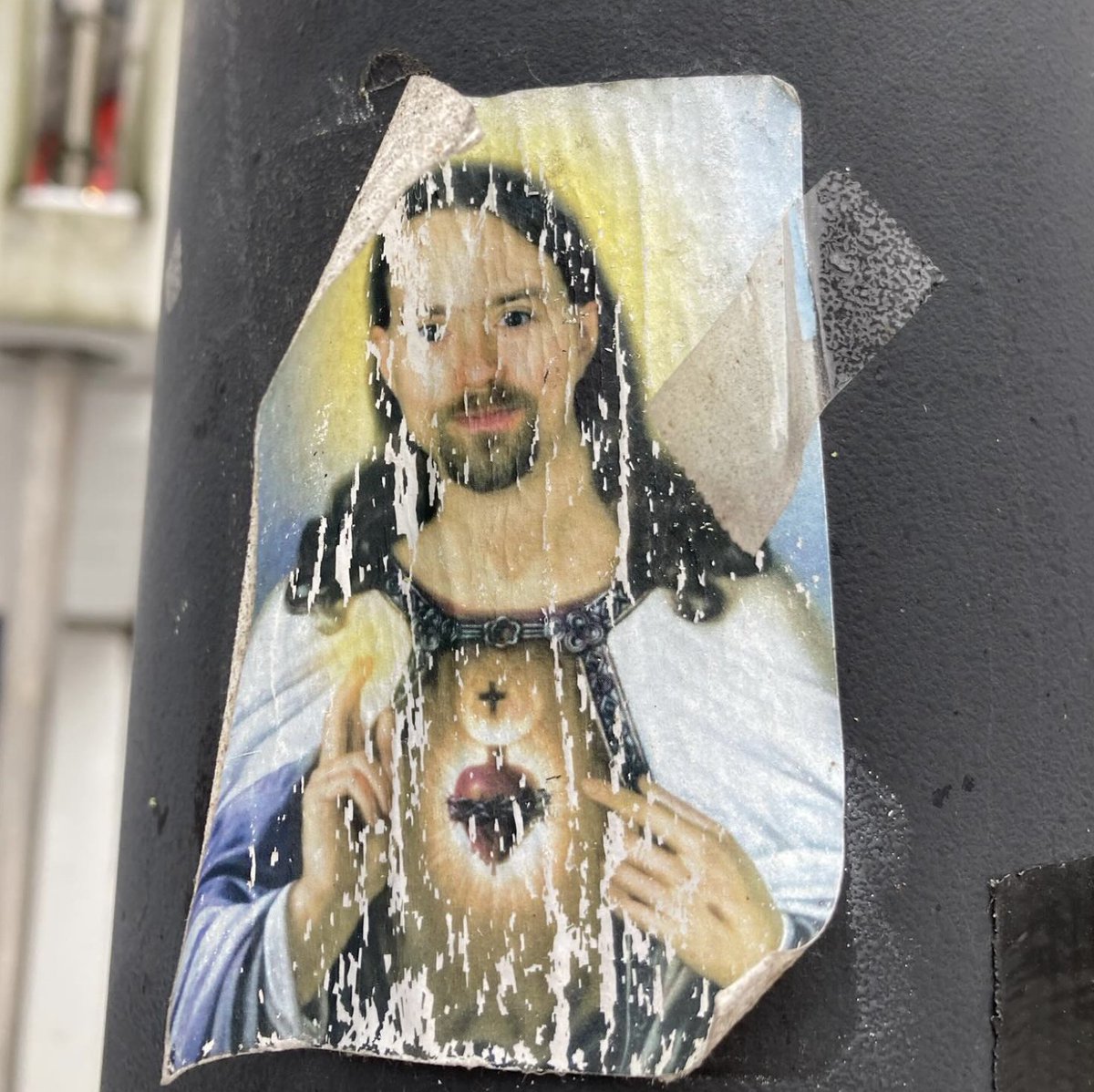 Colleague: 'Is there an old sticker of you as Jesus at that pole near the dining hall?' Me: 'Really? Some of my logic students made such a picture a while ago.' Colleague: 'Here, look.' Me: 'That's the one. Wow. Never seen it here. So crazy! Gotta love them students, though.'