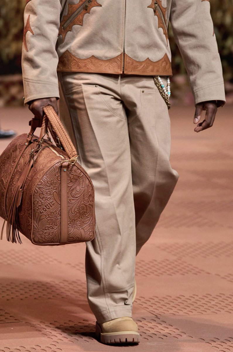 .<a href="/PUSHA_T/">King Push</a> models a look for the <a href="/LouisVuitton/">Louis Vuitton</a> Men’s by <a href="/Pharrell/">Pharrell Williams</a> #FW24 Paris show.