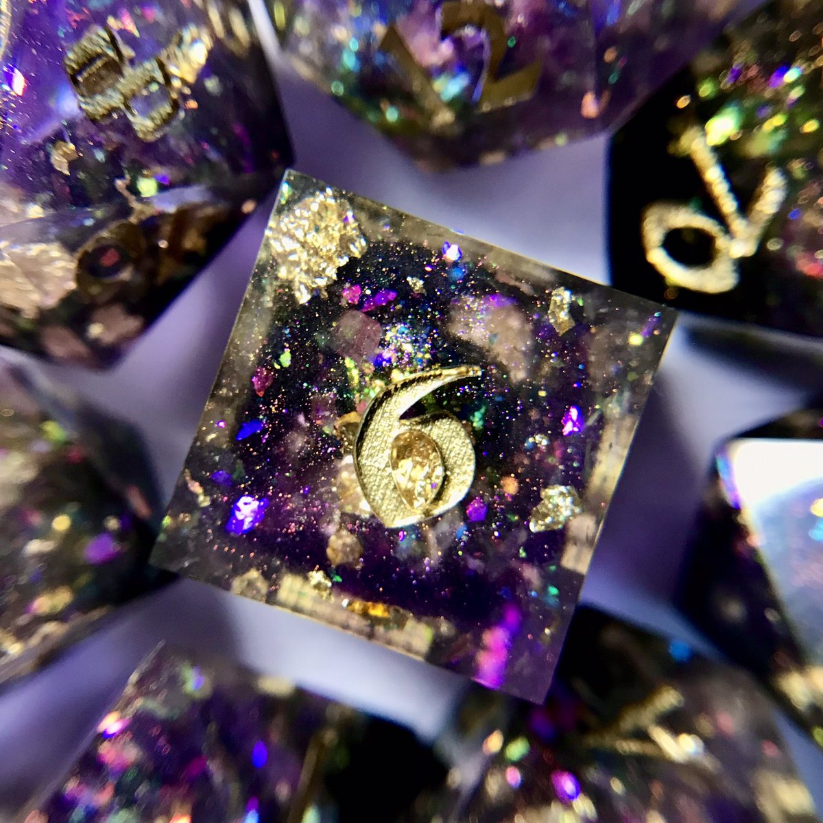 themoondjinn's tweet photo. it’s a #giveaway! 🎁

celebrating Sword of Souls on kickstarter ⚔️

enter to win this 9-pc #handmade diceset 👀

violet, glitter, &amp; classic gold ink 💎

to enter:
- like &amp; retweet this
- follow sword of souls on kickstarter (link in comments)

winner chosen 1/26 ⚔️

goodluck! 💜 https://t.co/jZINTOnNmG