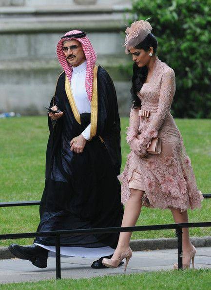 Saudi Prince Al-Waleed and his wife Ameerah dressed in Louis Vuitton. The hijab, burka, and niqab do not apply to the rich.