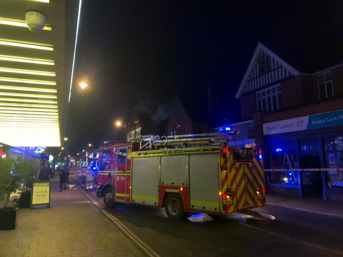 Fire at Emporium has been extinguished and the road reopened. Please do be careful on the roads as there is a lot of water about and it is likely to freeze overnight. We can confirm that nobody was hurt in the fire.