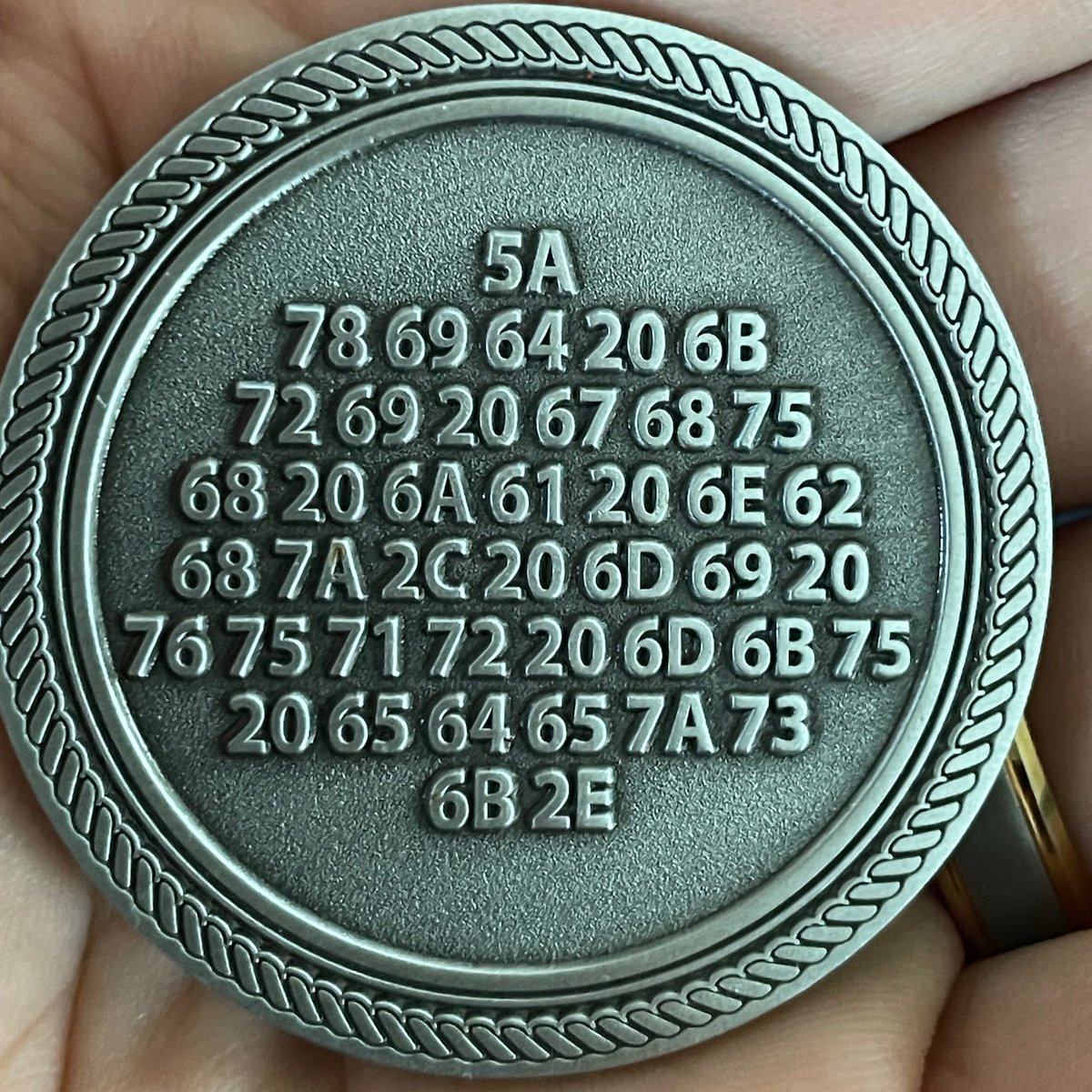 Do you recognize this logo?  I don't know where this coin came from...  I've deciphered the clue on the back, but still doesn't help me identify who this "g2" is.
