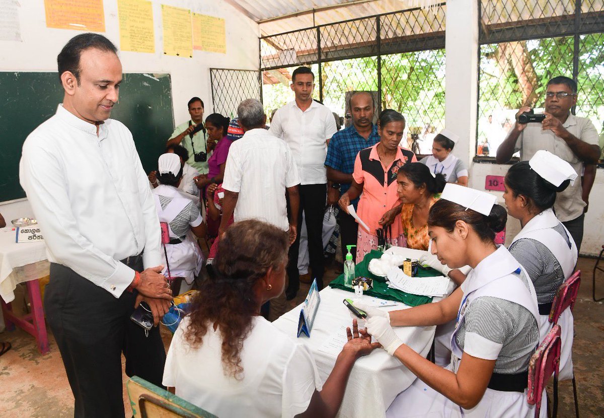 MoH_SriLanka's tweet photo. Suwa Udana mobile health clinic launched at Siwali Maha Vidyalaya, Galle, to uplift rural health. Led by Health Minister Dr. Ramesh Pathirana, this marks the first clinic of 2024. Minister connects with doctors and attendees. #Healthcare2024 https://t.co/qek34svOV4