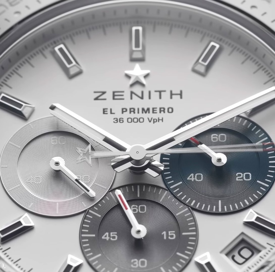 The Zenith Chronomaster Sport El Primero ~ Functions: Date – 1/10th of a Second Chronograph ~ Case: 41mm – Stainless Steel – 13.6mm Thick ~ Water Resistance: 100M ~ Movement ( El Primero 3600 ) 60-Hour Power Reserve – Automatic – 36,000 vph Frequency – 35 Jewels ~ MSRP: £9,700