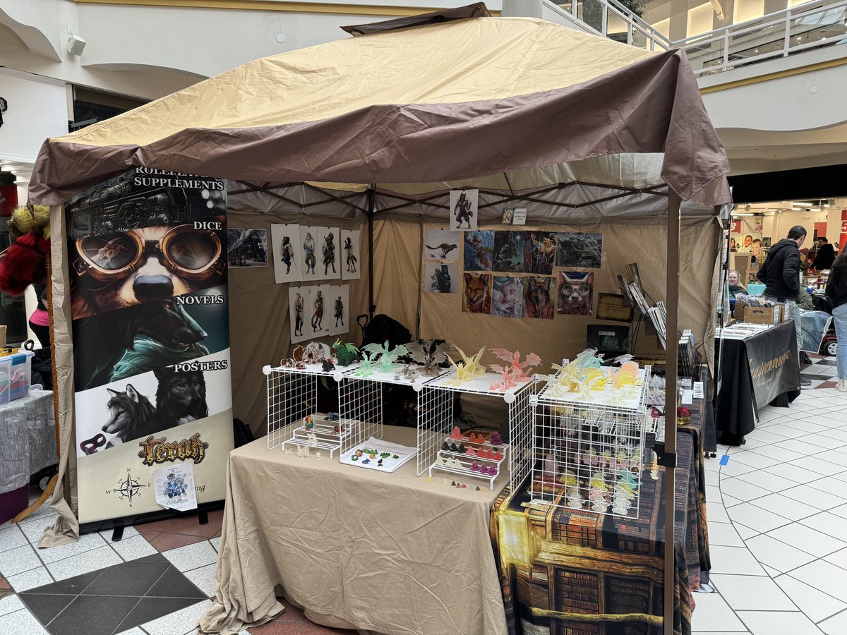 We're live at Authors in the Dungeon at #provotownecenter. We've got homemade dice, chocolate dice, prints from @GoldenDruid, coloring storybooks by Chaaya Chandra, @EllenNatalie87, and Phoenix Baldwin, novels, minis, and RPG supplements.