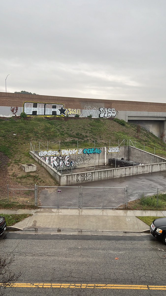 DomAznavour's tweet photo. @CaltransDist7 When will you be cleaning this up? I can’t get a hold of anyone at CalTrans to come and clean this mess up. You built this entire area and then decided not to put a lock on any of these fences, allowing people to not only enter and tag the area, but also camp out. https://t.co/DT1OJMMMKN