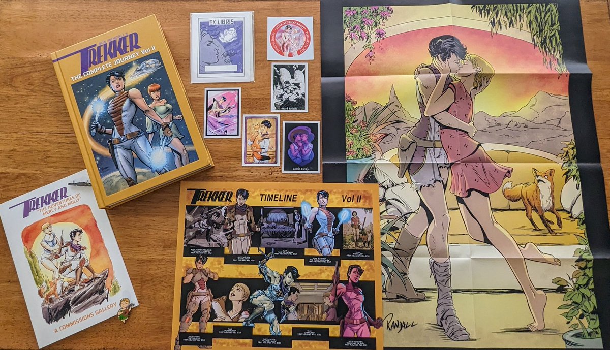 It's a Trekker-ific day! Just received our awesome rewards from the #Trekker Complete Journey Vol II #Kickstarter from @Ron_Randall! A beautiful 500-page book, timeline poster, commissions gallery, sticker, trading cards, and kiss poster! Excellent quality & value as always! 🚀