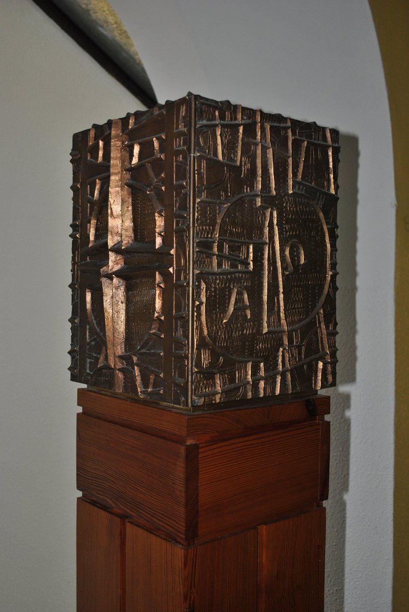 This interesting tabernacle is located in Camus Church in Connemara. I am trying to identify the metalworker who sculpted it.