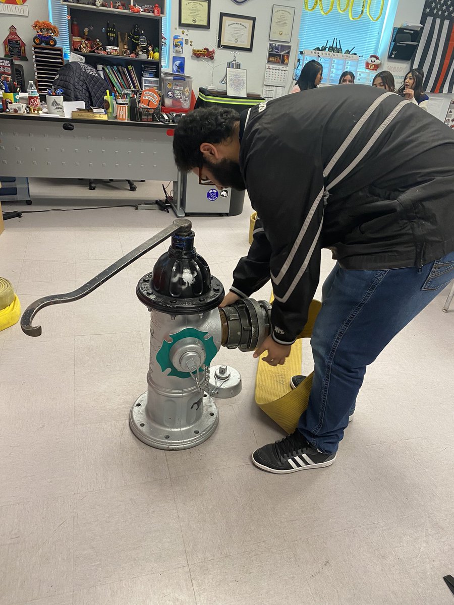 Firetech students learn proper hydrant catching techniques, a vital fire ground skill. #RepTheH #ScorpionStrong