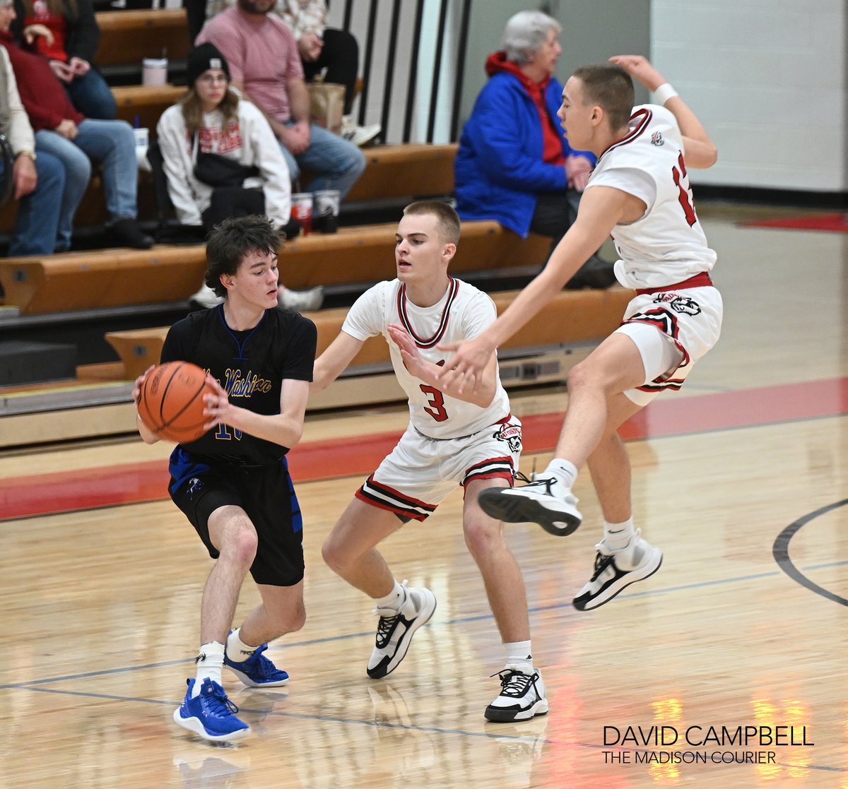 Madison's boys jumped out to a 25-0 lead and cruised to a 62-40 win over New Washington on Saturday. (Madison Courier Photos)