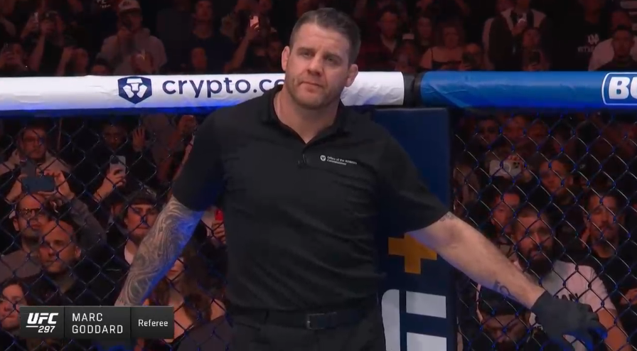 pepperyball's tweet photo. why the strickland v duplessis Ref be posing like this in the octagon https://t.co/cB5FwpsnYv