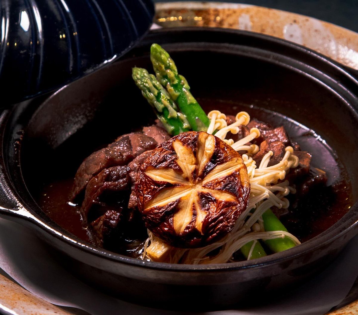 Nobu's Beef Toban Yaki - marinated beef seared to perfection on a hot cast-iron plate. Served with seasonal vegetables and a soy-based sauce for the perfect balance of sweetness and umami flavors. Come to Nobu and warm up with this delicious dish!