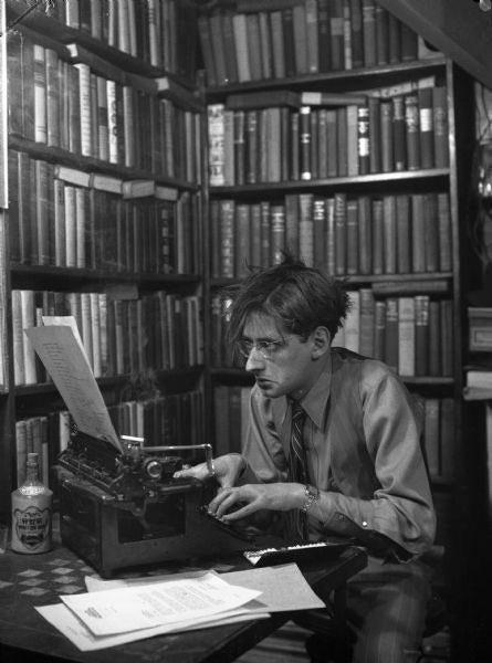 historydefined's tweet photo. The author of Psycho, Robert Bloch, writing at his desk, 1950s. https://t.co/vDMQawHdRT