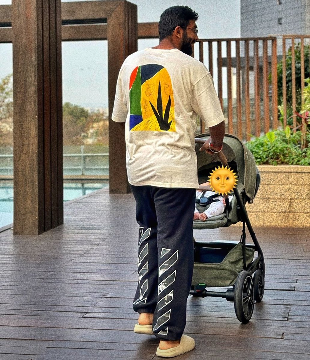Bumrah enjoying the time with his son. - A beautiful picture.