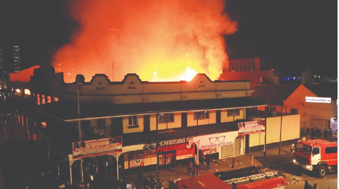 A fire erupted last night at a mall (corner Julius Nyerere and Speke), opposite Joina City. The inferno, suspected to be ignited by an electrical fault, wrought havoc on the bustling commercial hub, leaving numerous businesses in ruins and people grappling with profound losses.