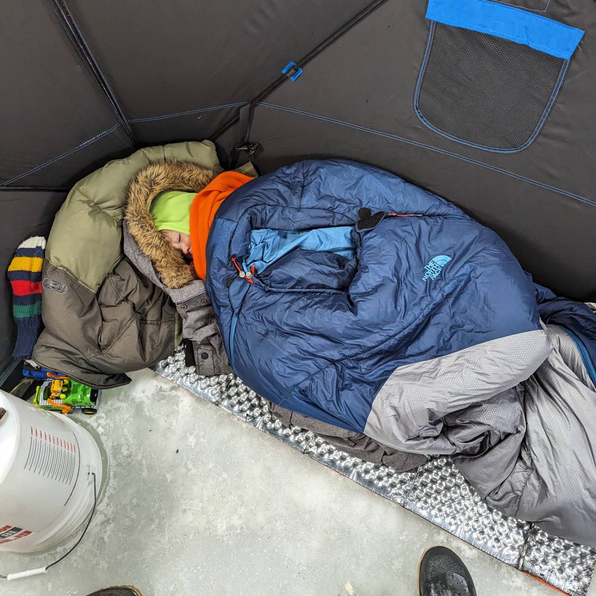 If you're #icefishing with an almost 3 year old, you better make sure you pack a ton of blankies! Caught 2 pike today. #getoutside #outdoorkids