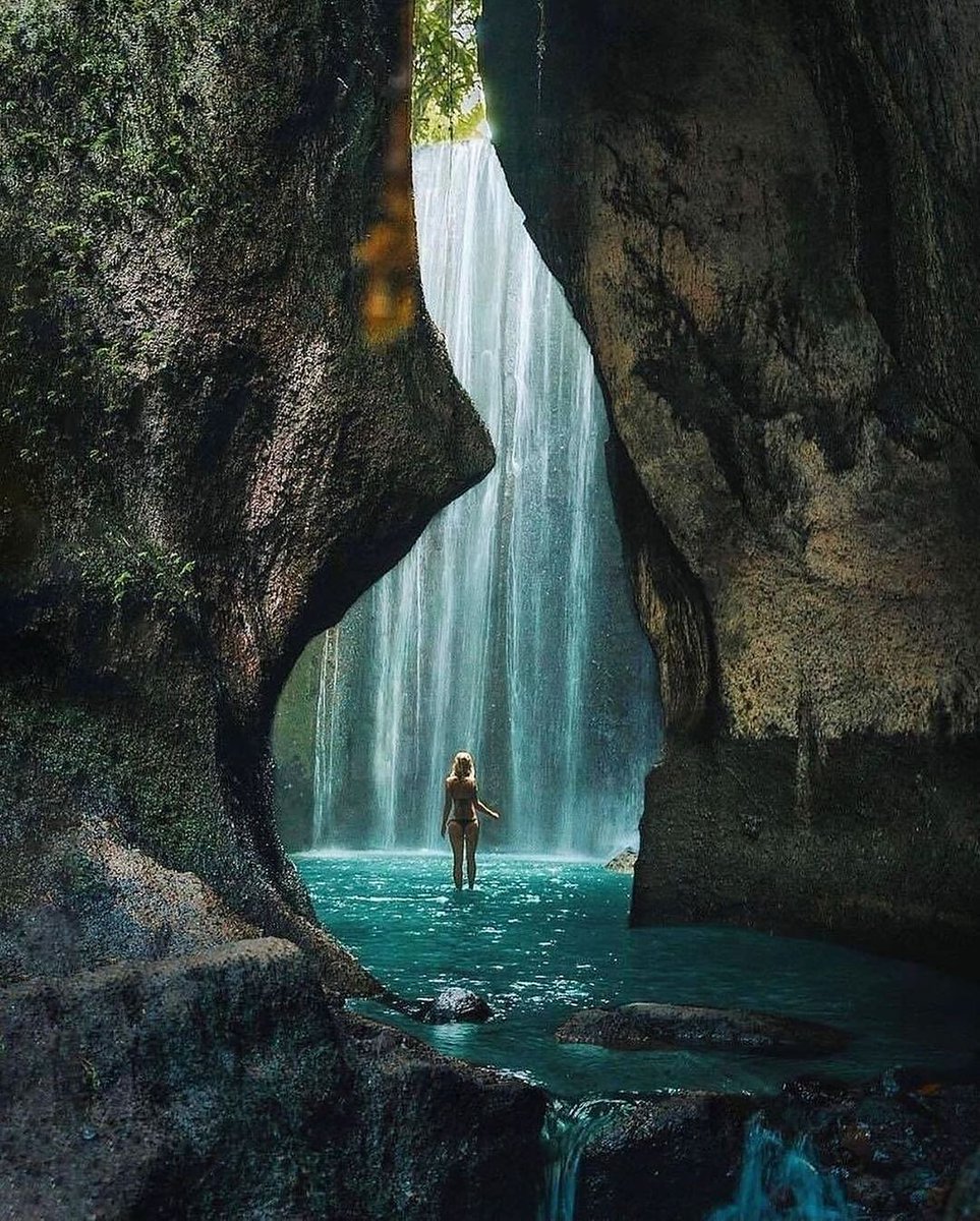 Sun-kissed beams peek through Tukad Cepung's cascades, Bali's hidden gem! 🌅💦 A tranquil trek to paradise in Bangli, far from the crowd. #HiddenBali #WaterfallWonder #BaliAdventure #WonderfulJourney #WonderfulIndonesia