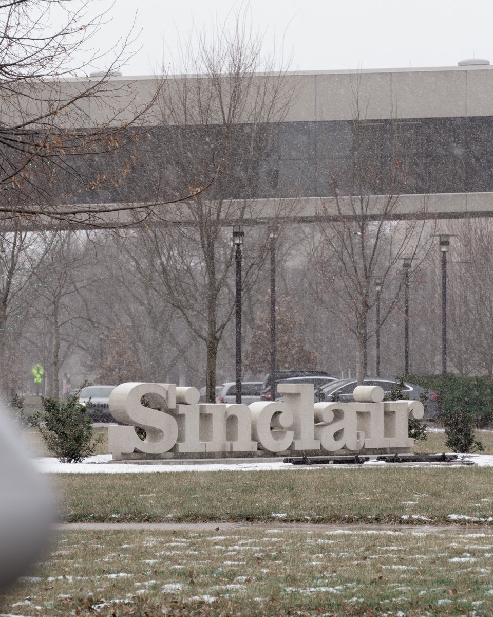 SinclairCC's tweet image. What a beautiful snowy day on Sinclair College's campus! The trees, buildings, and benches are all dressed in white, creating a serene winter wonderland. . Stay safe out there and have fun! ❄️☃️ #snowday #SinclairCollege #winterwonderland