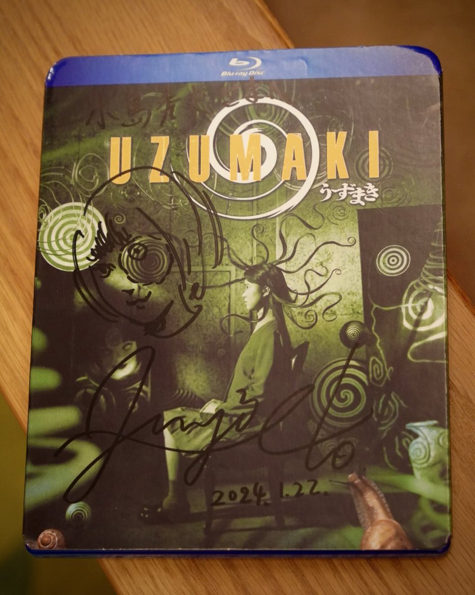 HIDEO_KOJIMA_EN's tweet photo. Today I met up with Junji Ito, whom I hadn't seen since the pandemic for the first time in 4 years, and rewatched the movie "Uzumaki" that I saw 24 years ago at the theater, on the North American BD (since the Japanese version is only available on DVD). 
I remember I saw it in Shibuya and it was a double feature with "Tomie," as I recall. 
In my warehouse tonight, I unearthed the manga "Uzumaki" and reread it.