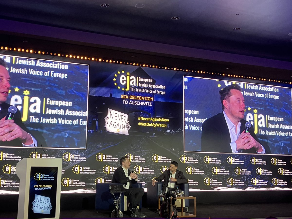 alja_brglez's tweet photo. Elon Musk at the @EJAssociation 
conference - he visited Auschwitz in the morning. How many of those lost lives could have been saved if we had had x/twitter 80 years ago, he wondered? https://t.co/E0SJGm4hT9