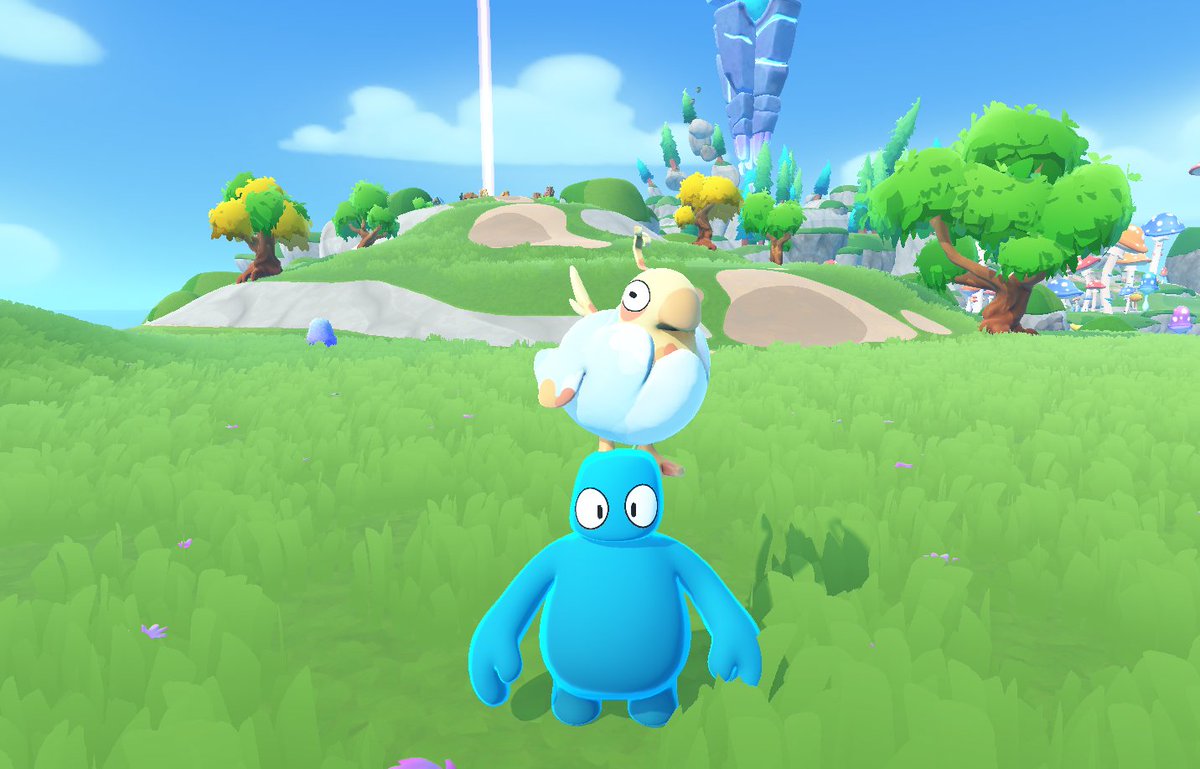 A blue Bud with a birb perched on their head, stood in the grassy plains of Southfield. In the distance, a monolith looms over a hill spotted with trees.