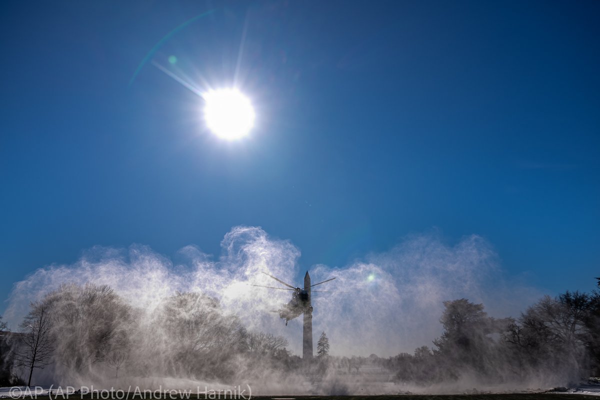 .@USMC Marine One with President @JoeBiden aboard kicks up a plume of snow as it arrives at the White House in Washington, Monday, Jan. 22, 2024, after returning from Rehoboth Beach, Del. (@AP Photo/@andyharnik)