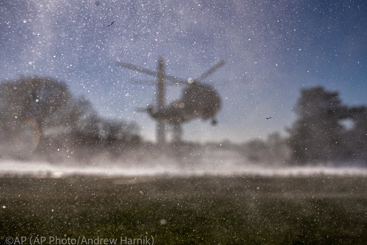 .@USMC Marine One with President @JoeBiden aboard kicks up a plume of snow as it arrives at the White House in Washington, Monday, Jan. 22, 2024, after returning from Rehoboth Beach, Del. (@AP Photo/@andyharnik)