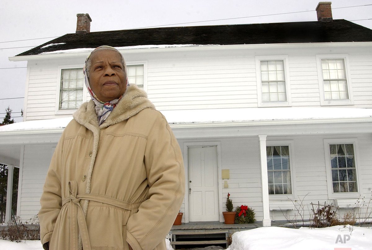 Pauline Copes-Johnson, Harriet Tubman's great-grandniece, poses in front of the Tubman home in Auburn, N.Y., Feb. 13, 2004.