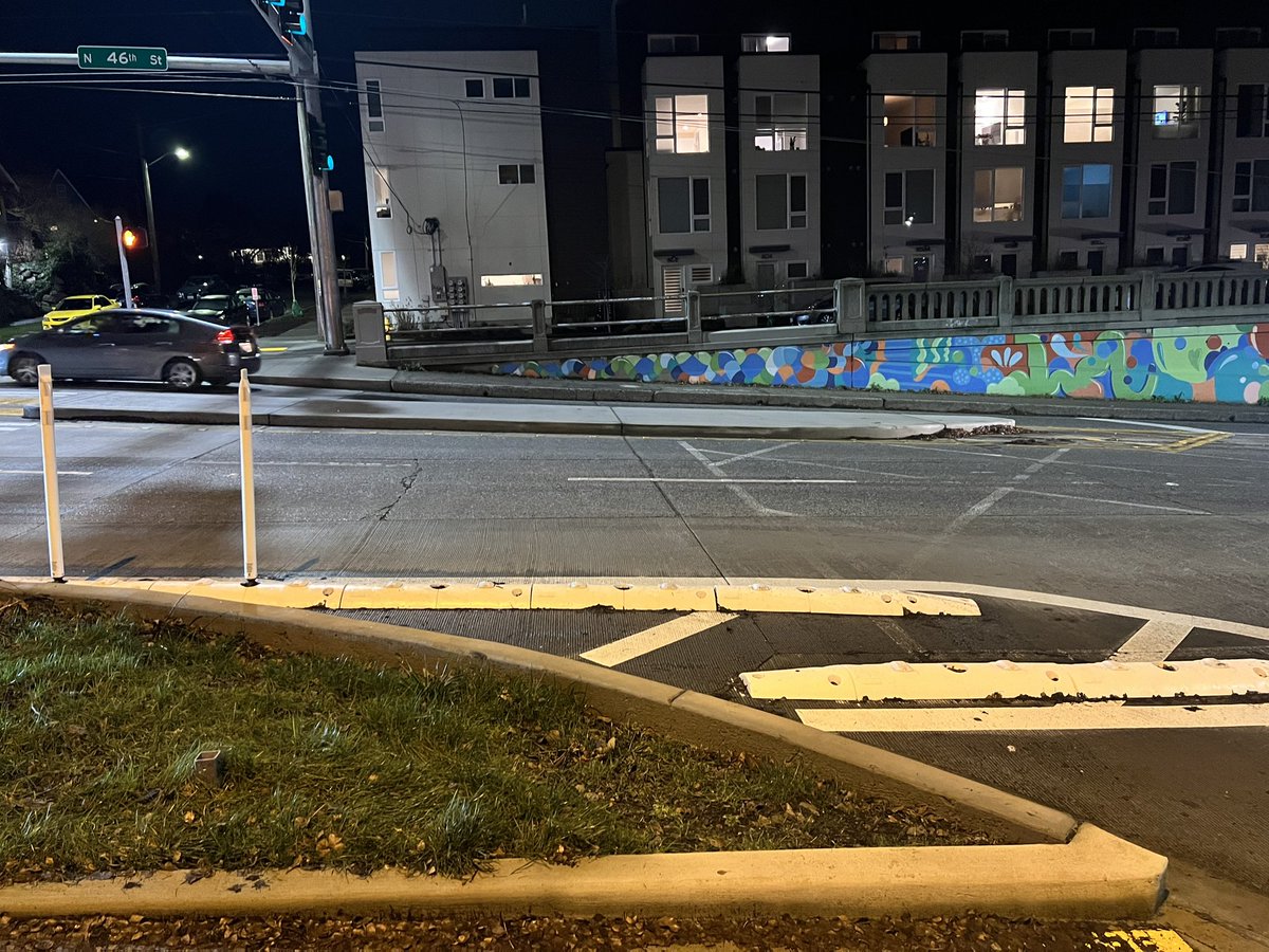 CarlSeip's tweet photo. Hey @seattledot almost every flex post on the corner of the improvements at 46th and Phinney Way (getting on SB Aurora) has been destroyed. Drivers fly thru this crosswalk at high speed even when the walk sign is on. Can u reinforce with concrete? Cc @Spottnik https://t.co/p4AAOtcph7