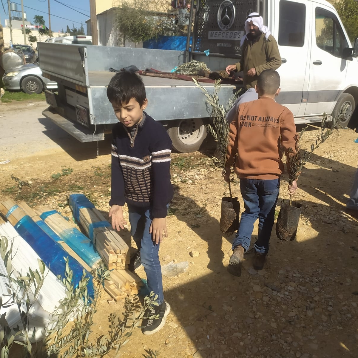 JAIPalestine's tweet photo. Some photos of olive trees' distribution among farmers in Dura and Yatta villages, Hebron area - January 2024 https://t.co/0JbjH42Vog
