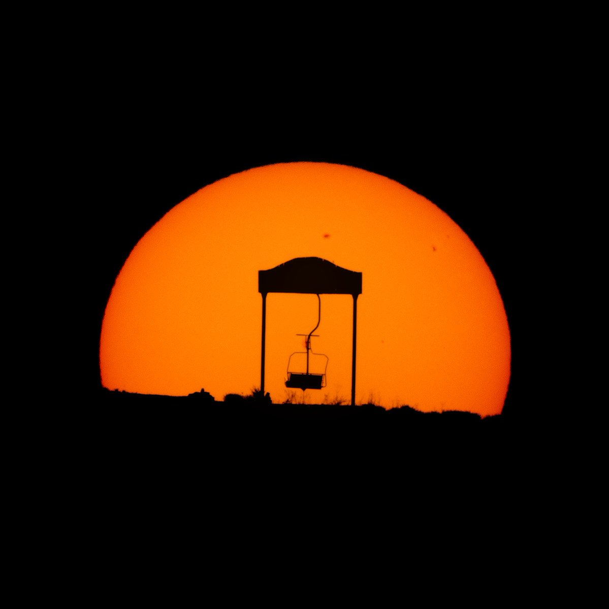 YBeletsky's tweet photo. Sunset behind a landmark ski chairlift bench in the #Andes mountains close to #Santiago. It never ceases to amaze me the power of proper planning of such alignments ! #Sony #Sun #silhouette #LatinAmerica #Chile #solar #Sigma #landscape #planitpro #astronomy #southamerica #alerta https://t.co/P4p663aqCO