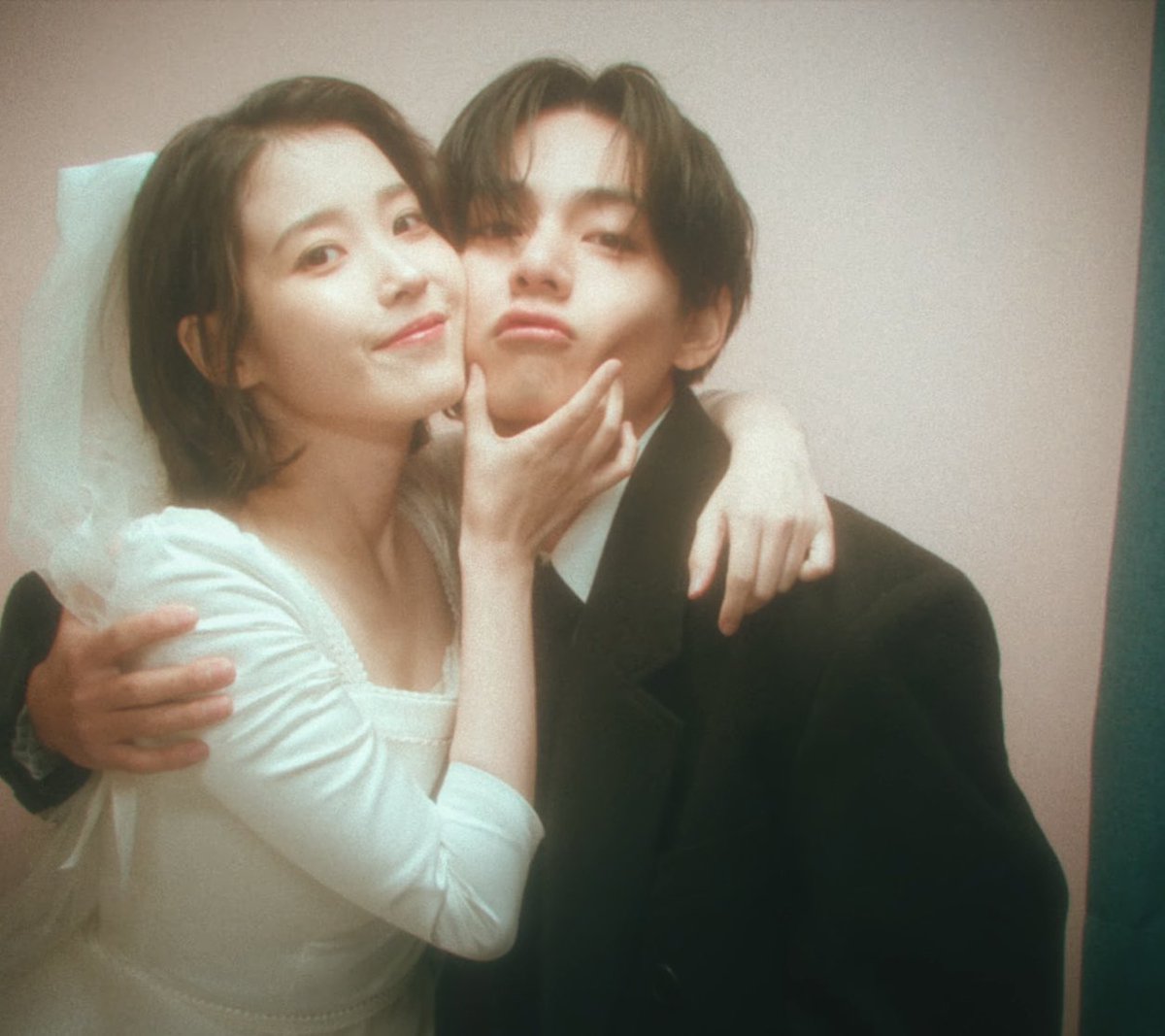 Koreaboo's tweet photo. I'm sorry but I am crying at how cute IU and V are for the "Love wins all" MV 😭🤍 https://t.co/QtKyiGKBZh