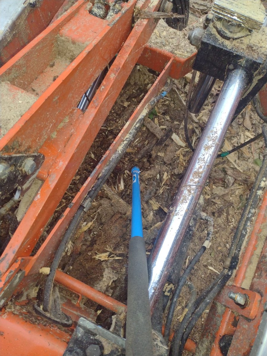 Another use for the #Logrite Hookaroon: cleaning out beneath the hard to reach parts of the #Woodmizer.
